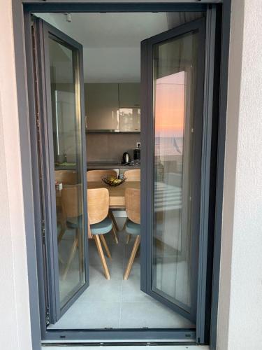 a view of a kitchen with a table and chairs at Vit'S sea Villa in Siviri