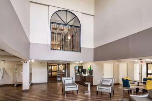 an empty waiting room with chairs and a table at Quality Inn Greer - Greenville in Greer