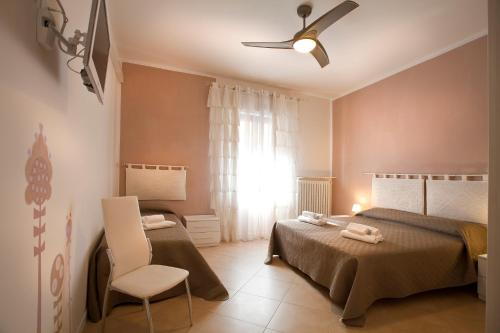 A bed or beds in a room at SUITE MORGANA in San Zeno