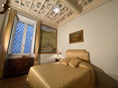 Ein Bett oder Betten in einem Zimmer der Unterkunft VesConte Residenza D'epoca dal 1533