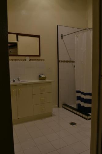 a bathroom with a shower and a sink at The Studio in Middlemount