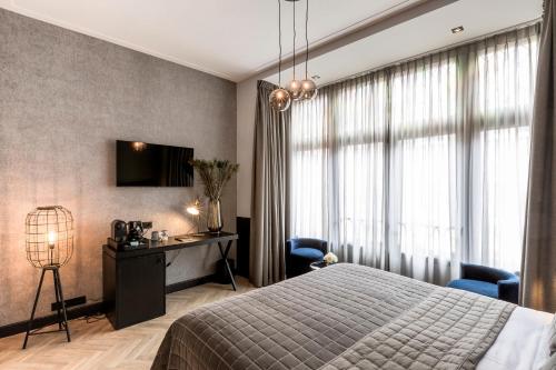 Säng eller sängar i ett rum på Cavallaro Hotel