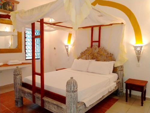 Postel nebo postele na pokoji v ubytování Watamu Solana Apartments