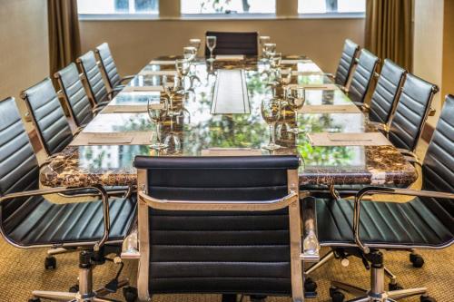 a long table in a room with chairs around it at Windsor Leme Hotel in Rio de Janeiro