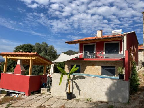 a house with a pool and a gazebo at Casa ponto Da Cruz t3 in Arcos de Valdevez