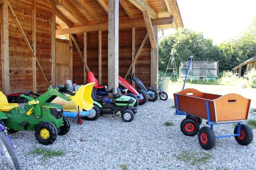 a group of toys parked outside of a building at Ferienhaus Eller in Traunwalchen