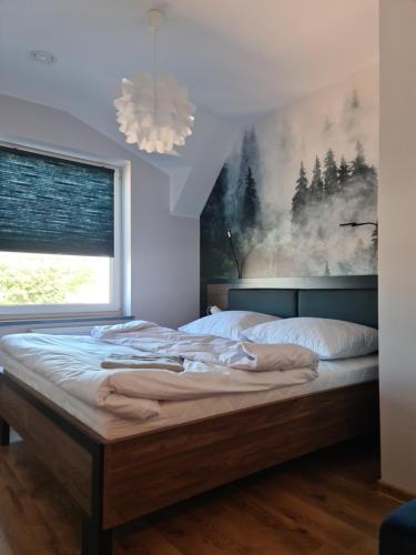 Posteľ alebo postele v izbe v ubytovaní Apartament Limanowa Rynek