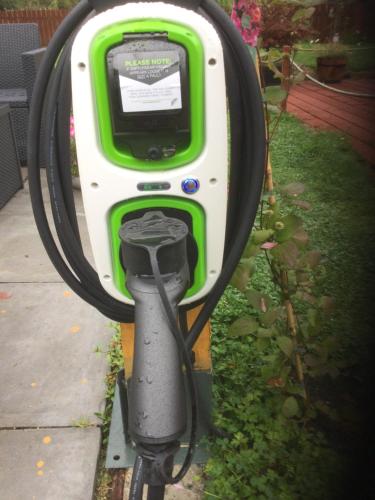 a green and white parking meter in the grass at Inverlochy Villas (Adults Only) in Fort William