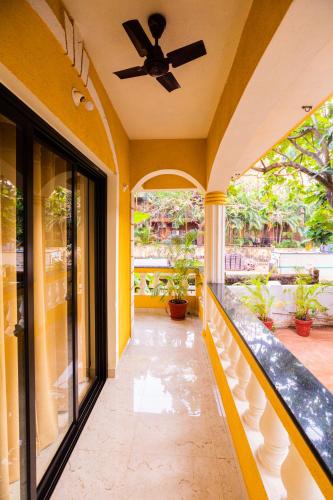 a hallway of a house with a ceiling fan at Primavera Holiday Homes-FAMILY RUN GOAN GUEST HOUSE in Candolim