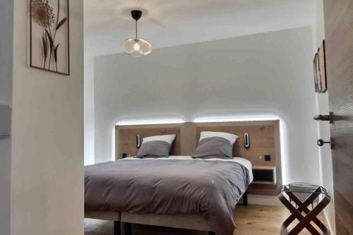 Krevet ili kreveti u jedinici u objektu Très bel Appartement en rez de jardin, Talloires