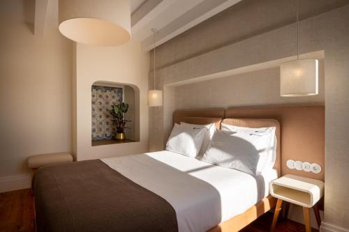 Katil atau katil-katil dalam bilik di Memoria Lisboa FLH Hotels