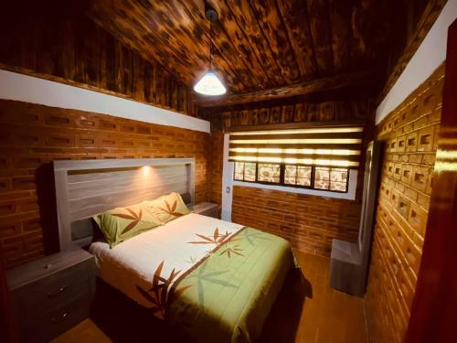 Tempat tidur dalam kamar di Quinta del Río
