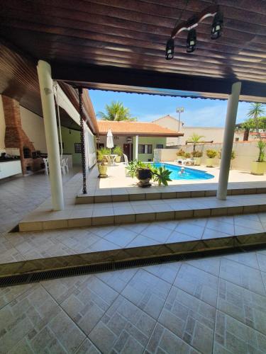 a view of a house with a swimming pool at Casa Morada da Praia in Boracéia