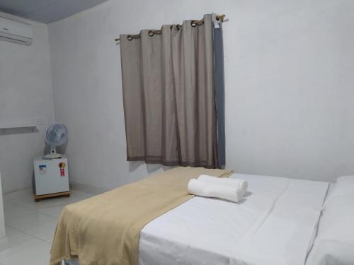 מיטה או מיטות בחדר ב-Pousada Águas da Chapada