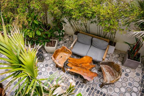 an overhead view of a living room with a wooden table and a couch at Numero Uno Beach House in San Juan
