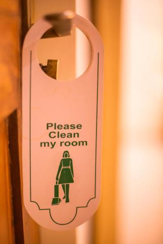a sign that reads please clean my room at Primavera Holiday Homes-FAMILY RUN GOAN GUEST HOUSE in Candolim