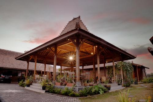 a building with a pavilion with a roof at Bhumi Kasuryan Borobudur in Borobudur