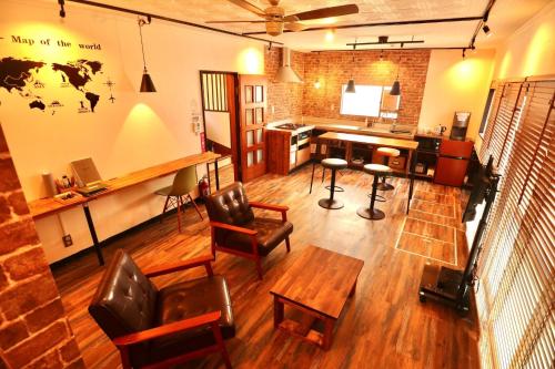 an overhead view of a room with a desk and chairs at Guesthouse Bontea - Vacation STAY 54022v in Kamakura