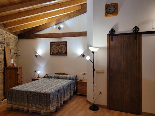 a bedroom with a bed in a room with wooden ceilings at La Cantina in Chanos