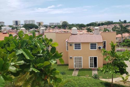 a house with a view of a city at Nueva Casa de playa Brisas del Mar in Ixtapa
