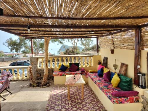 a living room with a couch and a table at Les IRIS in Al Hoceïma