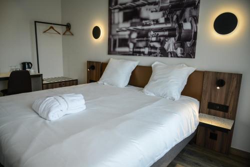 Cama o camas de una habitación en Pegard Andenne Centre