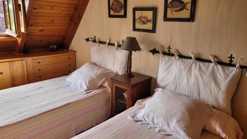 Postel nebo postele na pokoji v ubytování La Casa Bonita Cercedilla