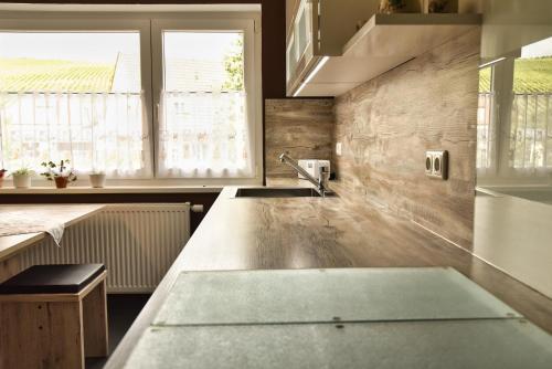 a kitchen with a concrete counter top and a window at Ferienwohnung Landsknecht in Volkach