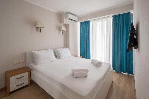 Una cama o camas en una habitación de Orbi Beach Tower Hotel Official