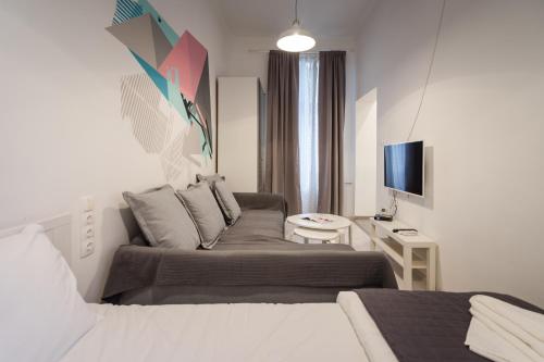 Postel nebo postele na pokoji v ubytování BpR Art of Rainbow Apartments
