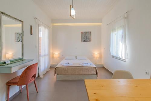 A bed or beds in a room at Christina Boutique Studios Elounda