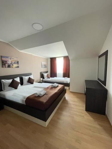 Ένα ή περισσότερα κρεβάτια σε δωμάτιο στο Panorama apartments
