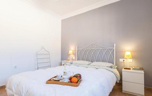 מיטה או מיטות בחדר ב-la casita de la palmera