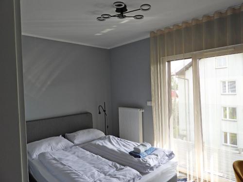 Ένα ή περισσότερα κρεβάτια σε δωμάτιο στο Apartament A2D Kraków