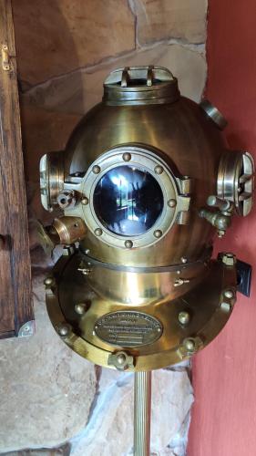 a large metal object is on a wall at Villa Zoryany Dvir in Skhidnitsa
