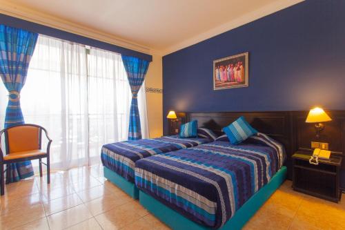 Cama o camas de una habitación en Hotel Argana Agadir