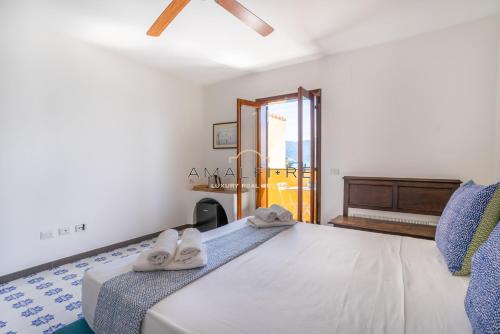 Posteľ alebo postele v izbe v ubytovaní Poseidone Suite , a due passi dalla spiaggia