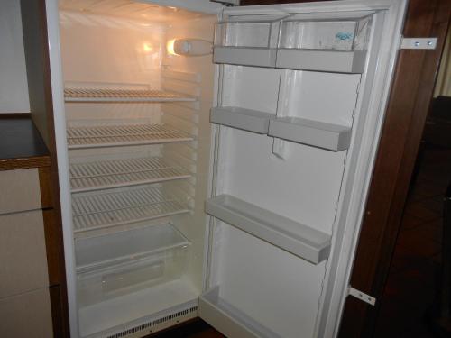 an empty refrigerator with its door open in a kitchen at Residence Silvester in Racines