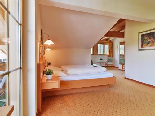 a bedroom with a bed in a room at Hotel Stern in Ehrwald