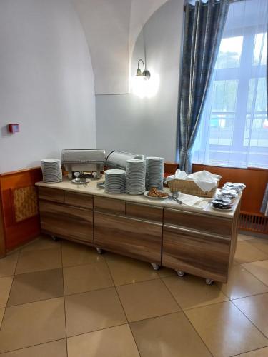 a table with plates of food on top of it at A-M Condominium in Veszprém