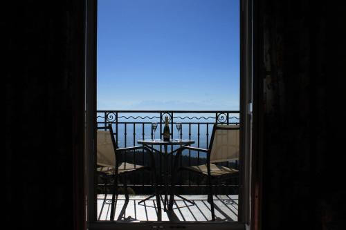 a view of a balcony with a table and chairs at Grand Hôtel des Rasses & Wellness in Les Rasses