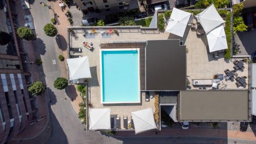 an overhead view of a swimming pool in a city at Hotel Admiral Lugano in Lugano