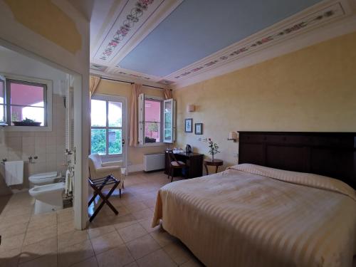 Postel nebo postele na pokoji v ubytování Il Melograno Country House