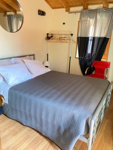 En eller flere senge i et værelse på Casa Ponto Da Cruz