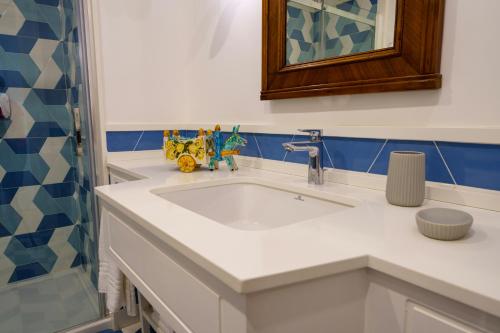 a bathroom with a sink and a shower at Villa Manning Relais in Sorrento