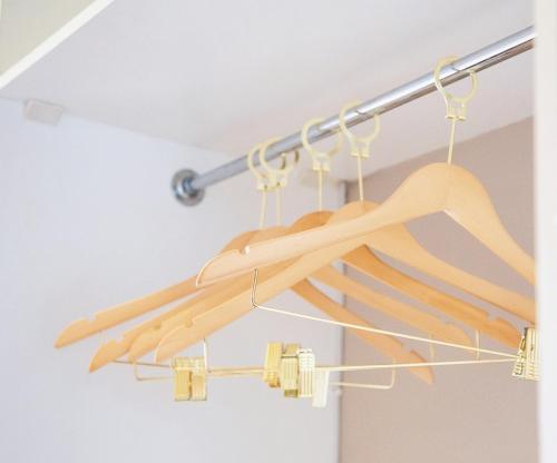 a rack of wooden hangers in a room at Schimper View Boutique Guest House in Louis Trichardt