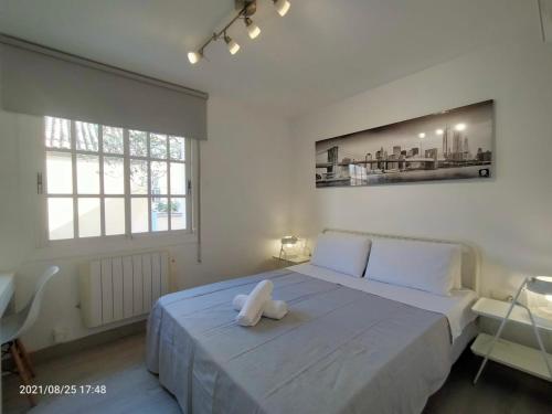 Un pat sau paturi într-o cameră la Casa Flores del Mediterráneo