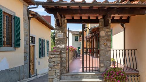 an alleyway in an old town with buildings at Hotel Villa Bonelli in Fiesole
