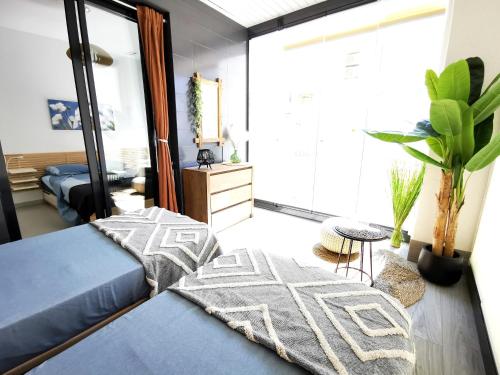 a living room with a bed and a large window at Superior Calpe Pearl Beach in Calpe