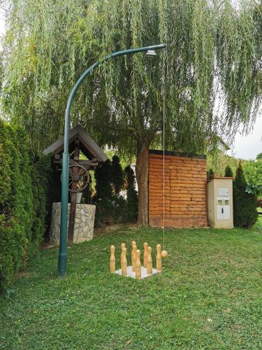 a group of chessetts in a yard with a street light at Kuća za odmor Belle Amie in Krapina